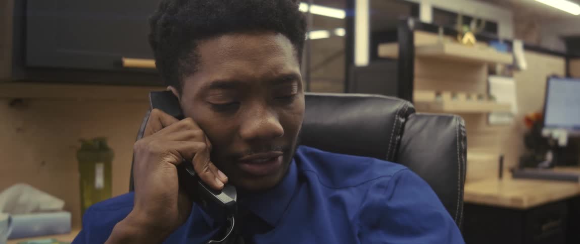 The office worker is talking on the telephone