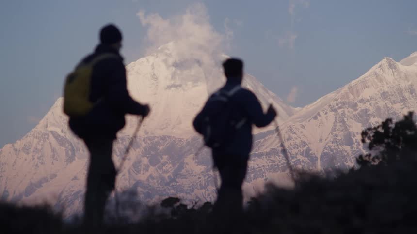 A clip of two people hiking the mountain