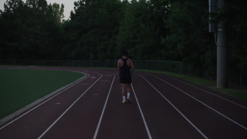 A footage of an athlete walking on a track