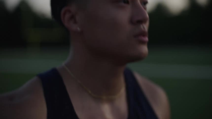 Portrait of a focused man running outdoors