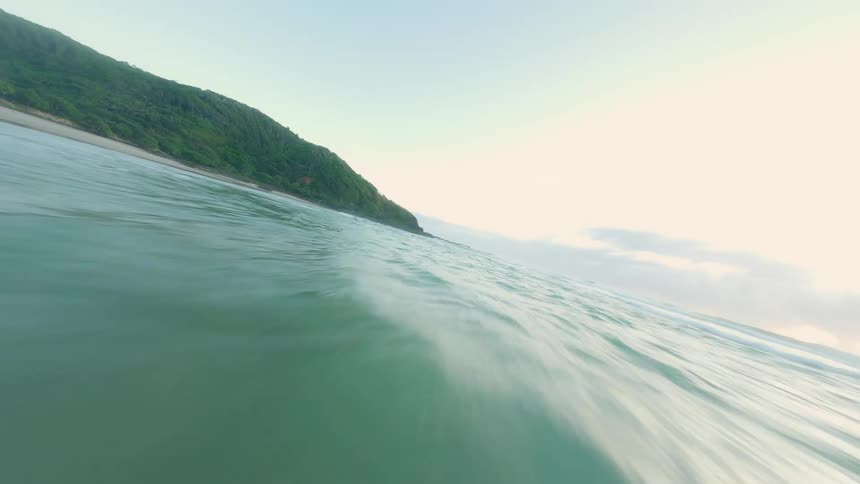 Aerial panorama of mountains with forests and in front a beach with a vast sea