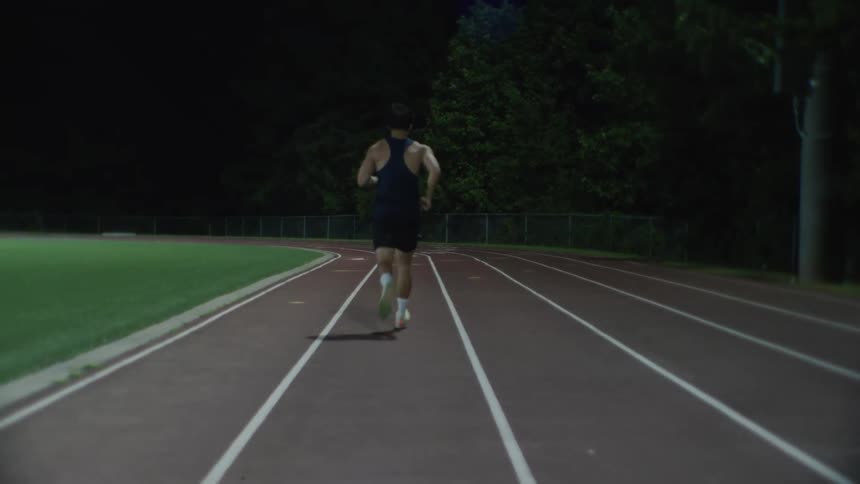 A man is running track