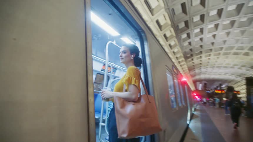 Woman getting on a train