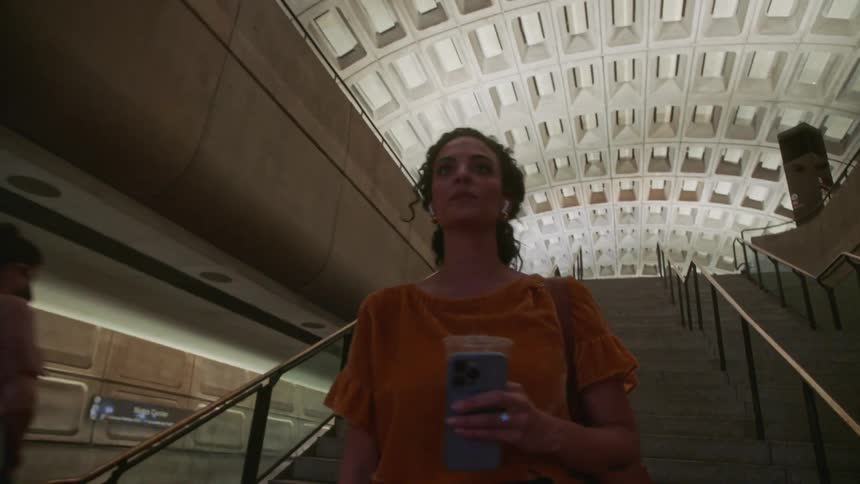 A clip of a lady walking down the stairs