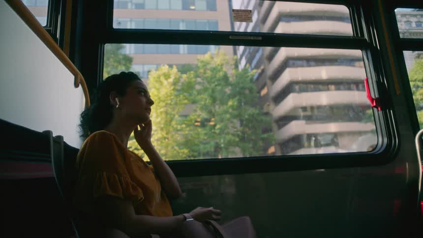 A clip of a lady sitting in the bus