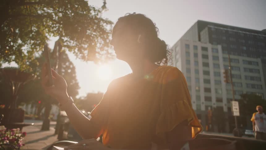 A clip of a lady siting and making a video call