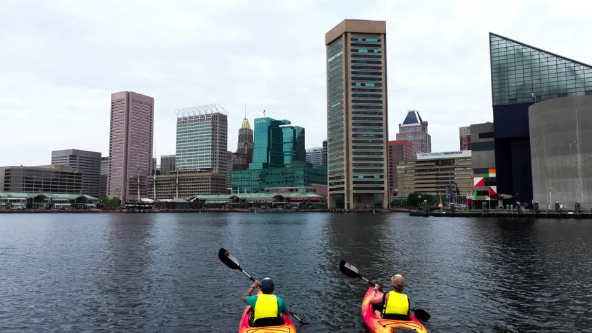 Metropolises with modern buildings by the sea on a cloudy day