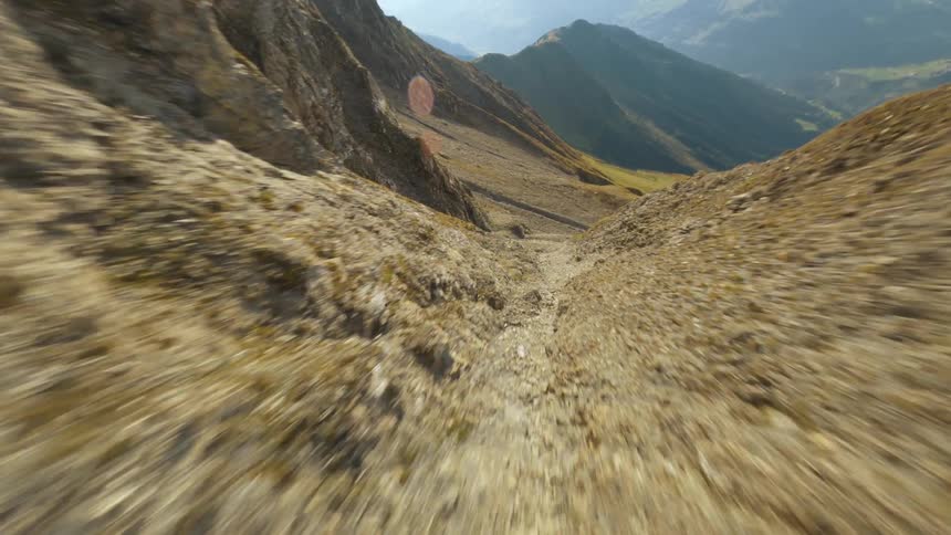 Flying Down a Mountain, Low Through Canyons with an FPV Drone