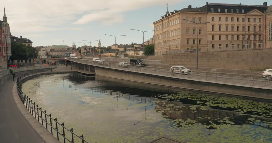 A clip of a lake beside the road