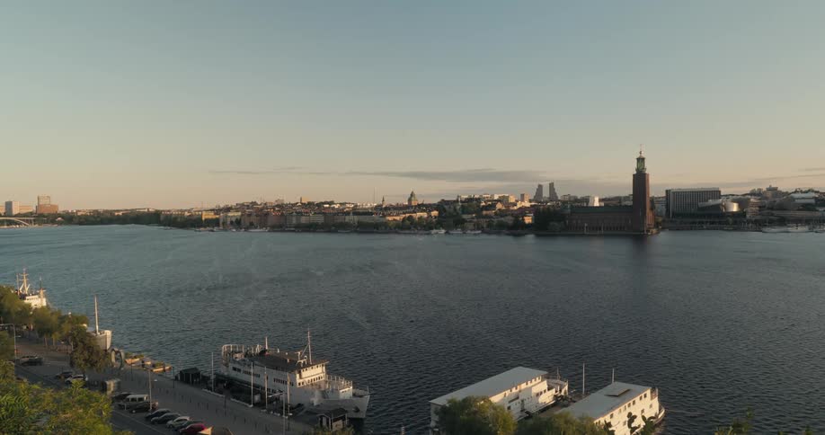 Some coastal buildings of a city with a wide water channel in the middle
