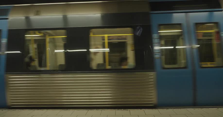 A subway train leaves the station