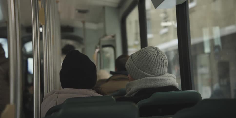 Passengers getting on and others sitting on a bus