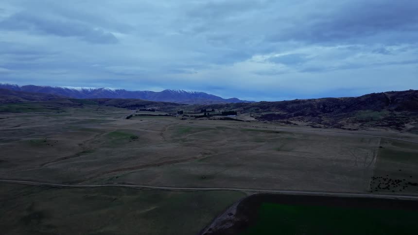 Heavy clouds cover the rural landscape at dusk