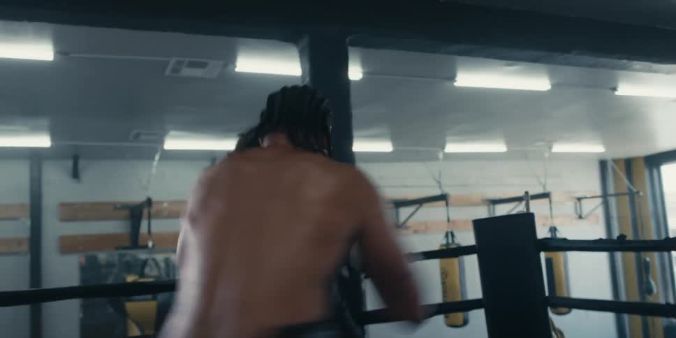 Two men fighting brutally in a boxing ring