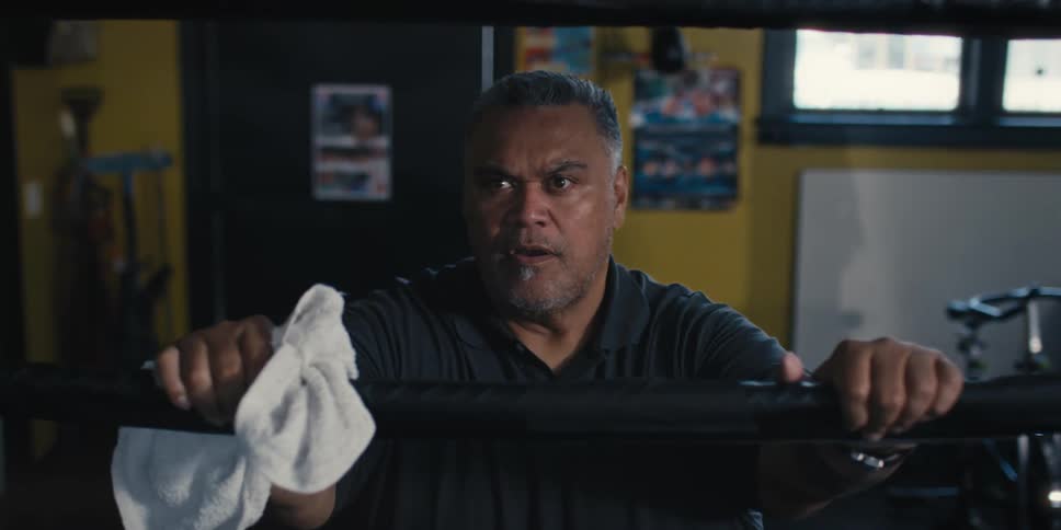 Man talking to someone inside a ring