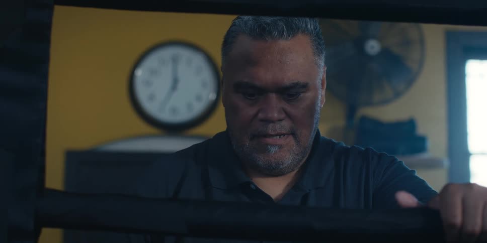 A man looks down thinking about something