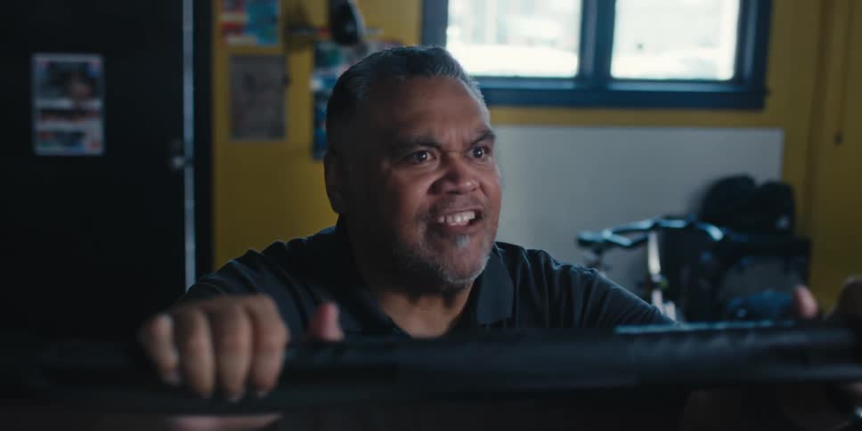 Man screaming while standing outside a ring