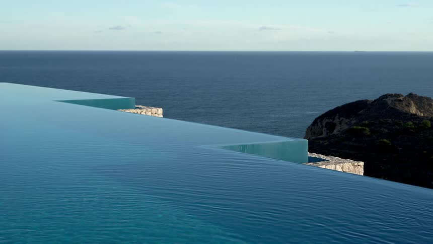 Infinity pool with a seamless edge blending into the ocean horizon