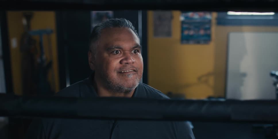 Man screaming outside a boxing ring