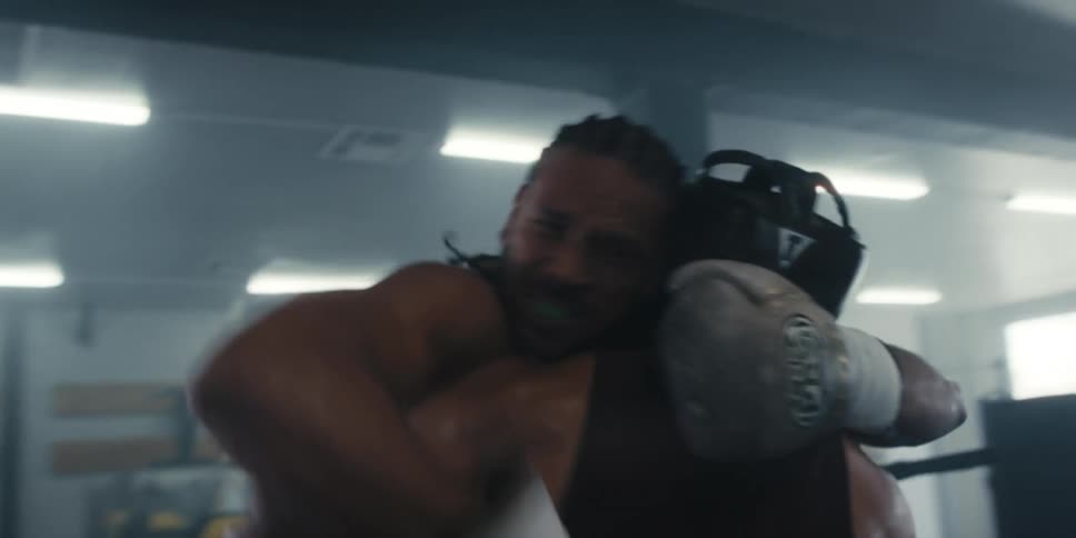 Two men fighting brutally in a boxing ring