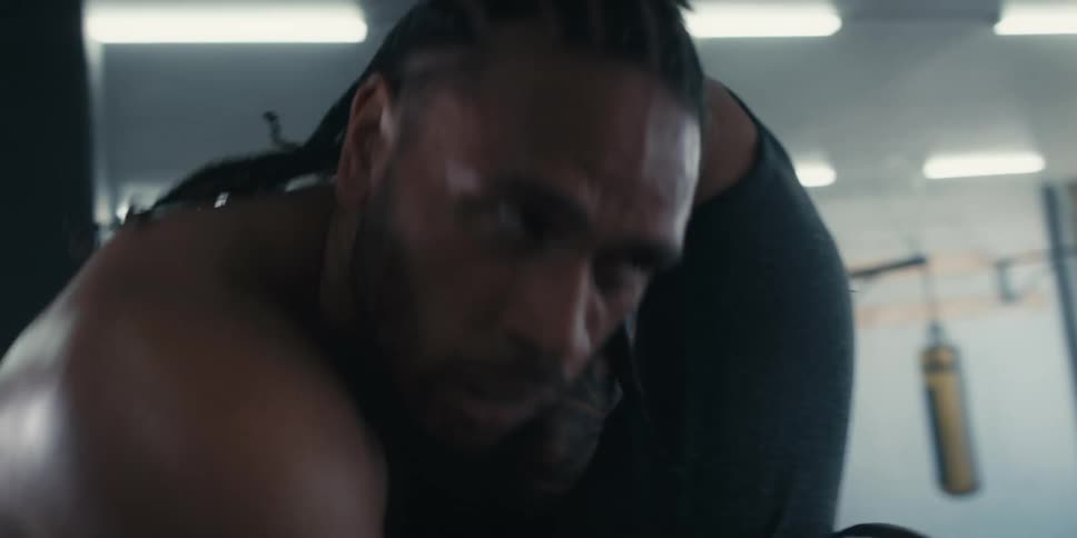 Two exhausted men boxing
