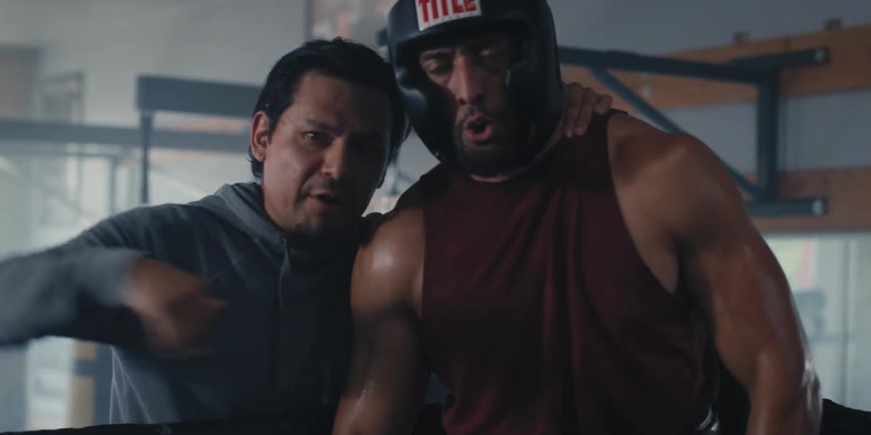 Trainer giving instructions to a boxer