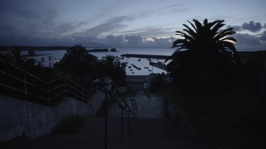 A staircase leads down to the shore