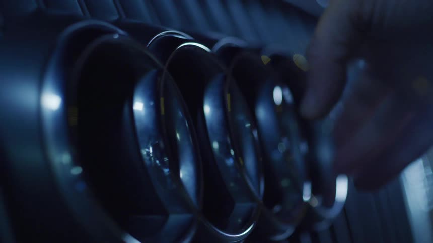 Persons hand being passed over the logo of an audi on the front