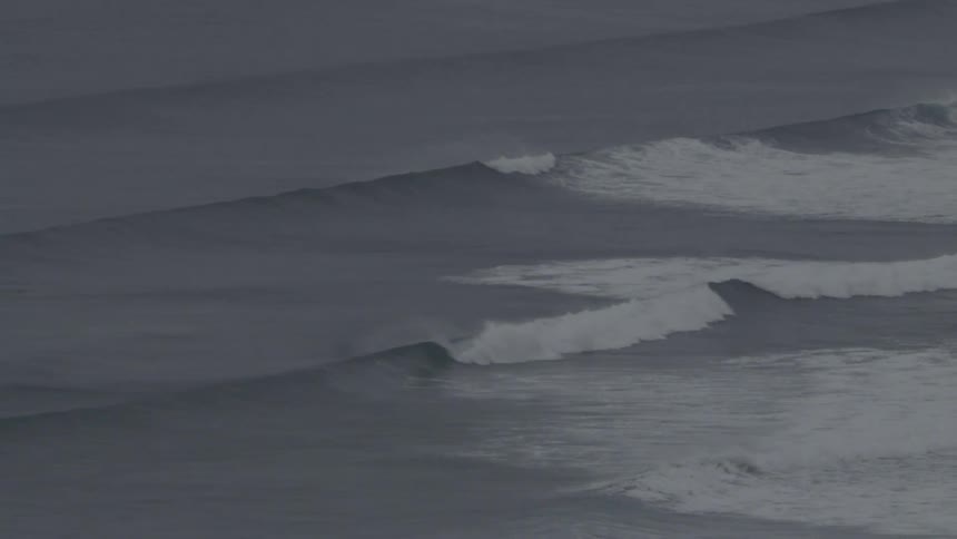 Foaming waves in a vast ocean