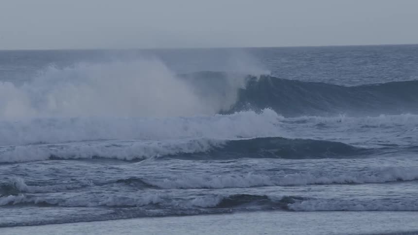 Person tubing a big wave in the sea