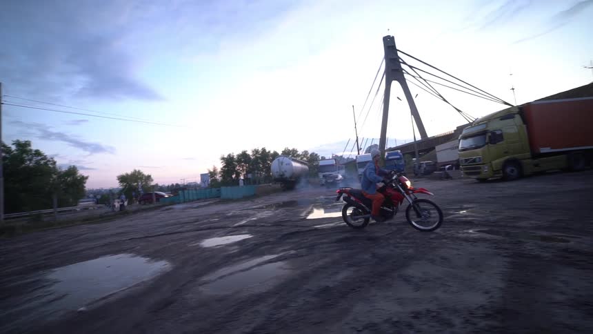 Man riding a motorcycle in a circle