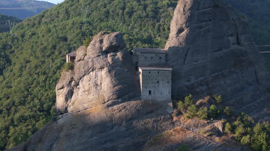 An old fortress carved out of the side of a mountain