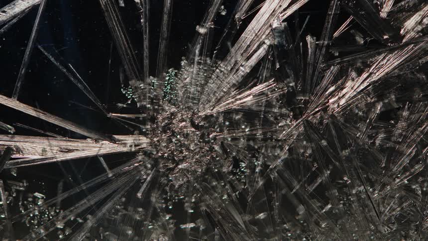 A cracked ice surface that is breaking and expanding its cracks