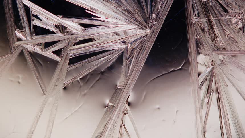 Close up of sharp thin growing crystals