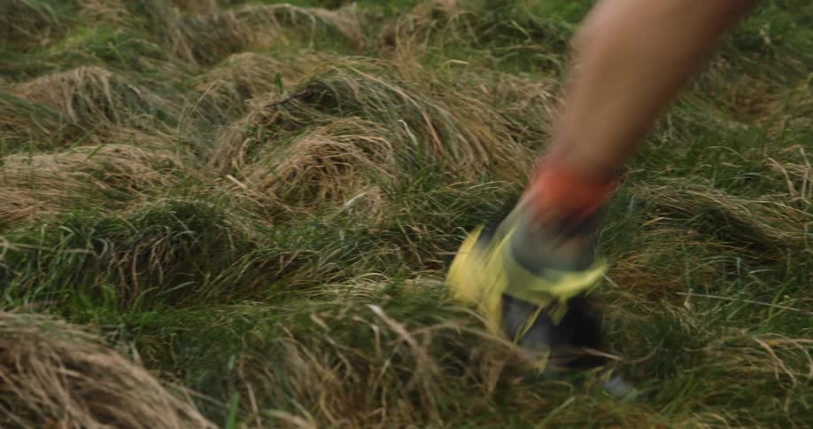 A man runs through the grass