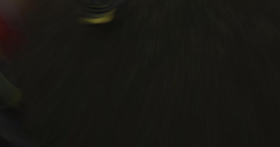 A person wearing running shoes runs down a dirt path