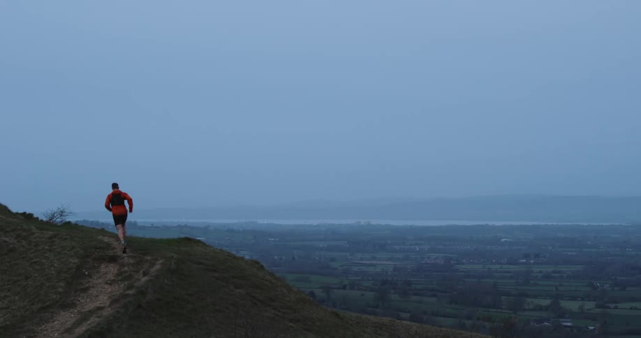 A man runs up the mountain path