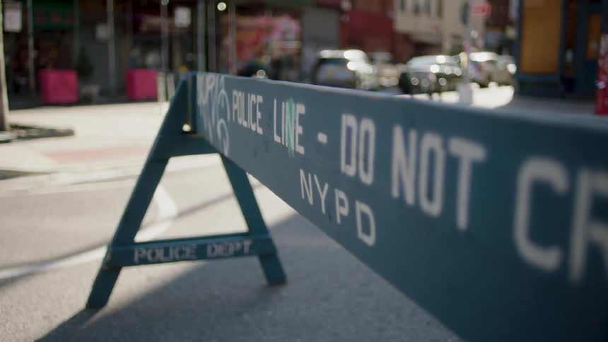 Blue police barrier on a city street