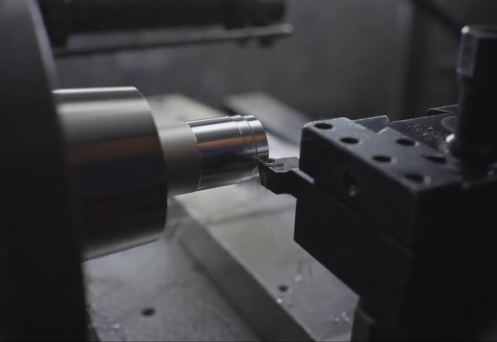 Metalworking machine scraping the side of an object