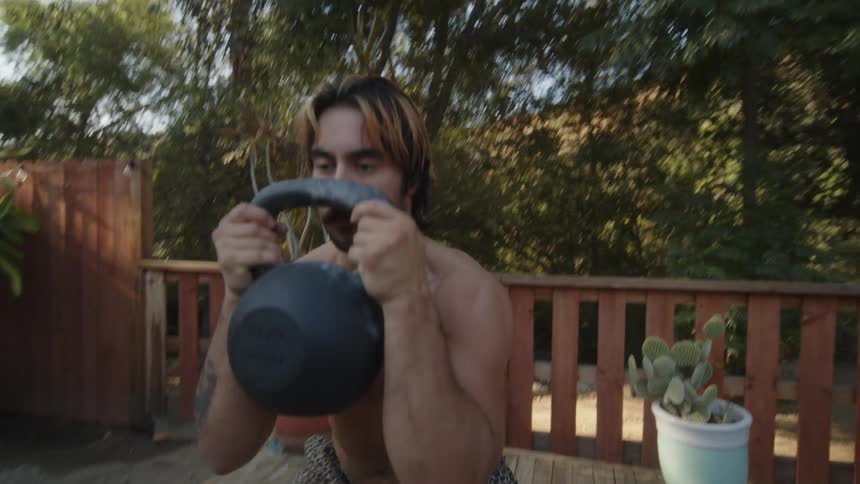Man doing squats with free weights