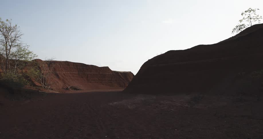 Aarid desert terrain with sparse vegetation