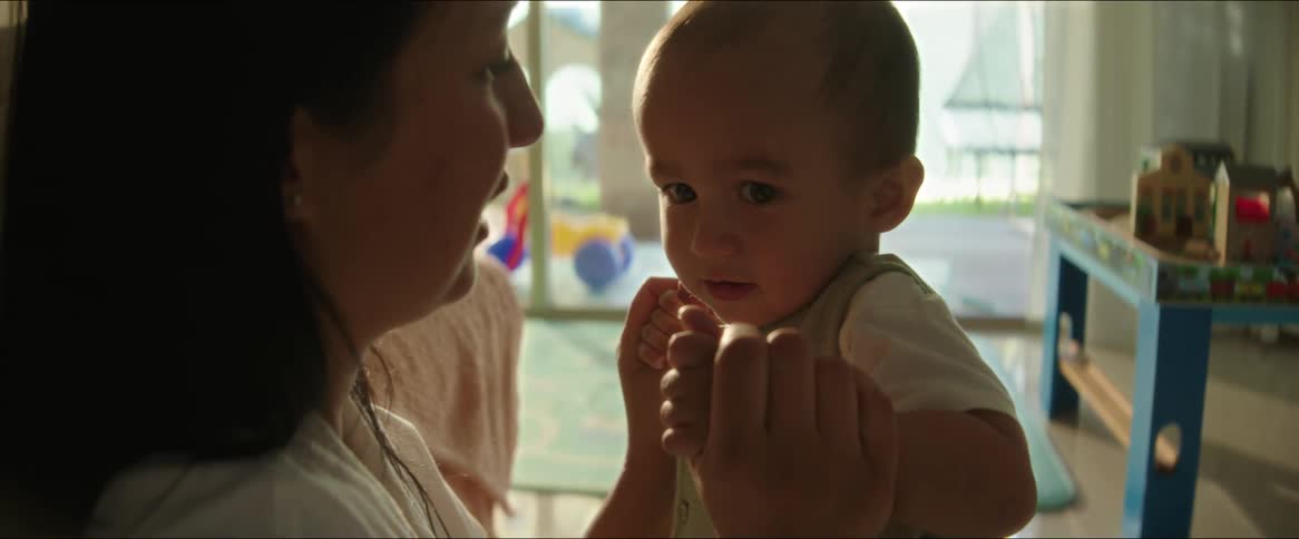 A mother is talking to her baby