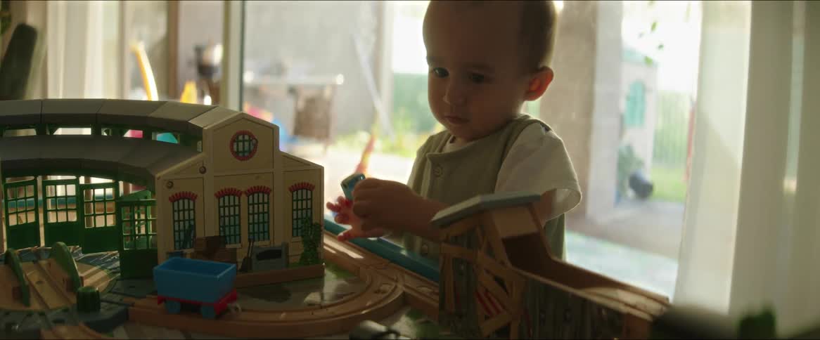 Little boy playing with trains