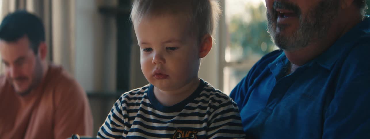 Child sitting on fathers lap