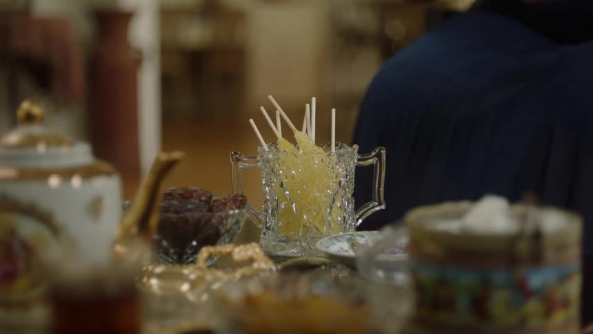 Hands picking up food from the table