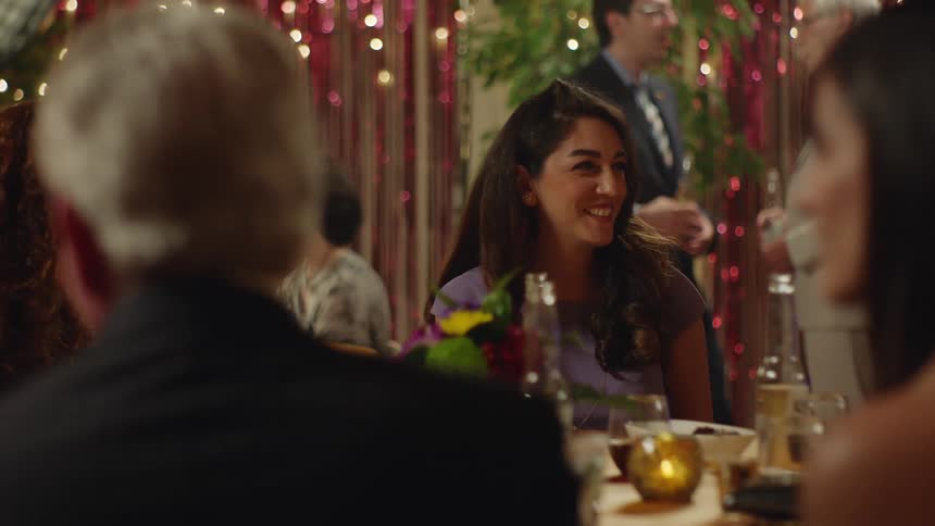 People sitting at a table during a party