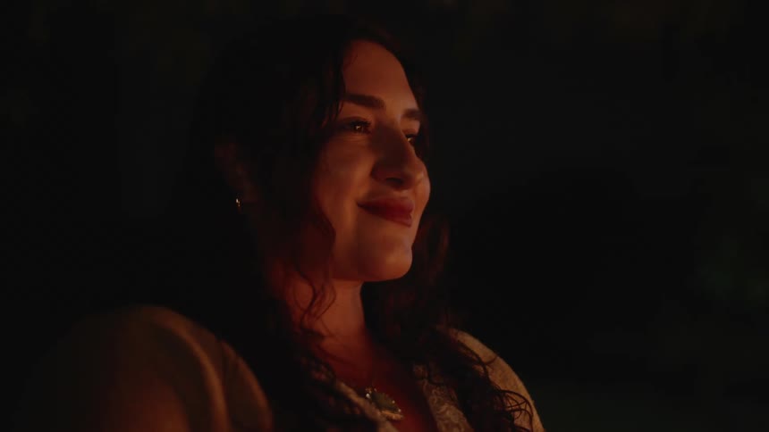 A night clip of a lady smiling