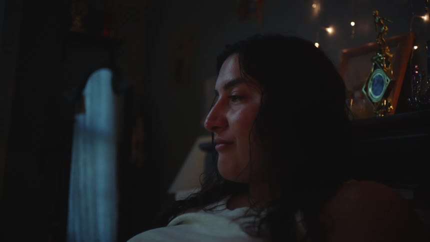 Portrait of a woman lying in bed