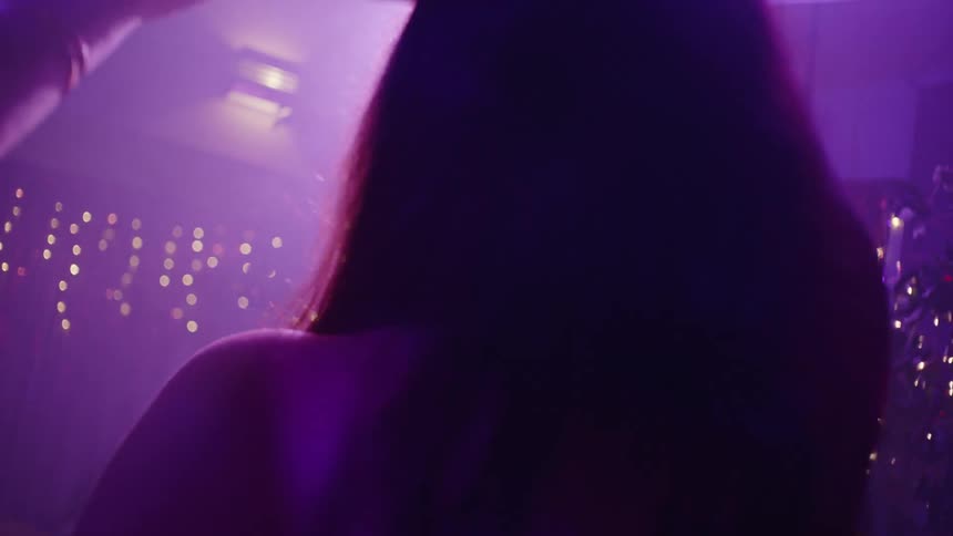 Cheerful woman dancing in a party atmosphere
