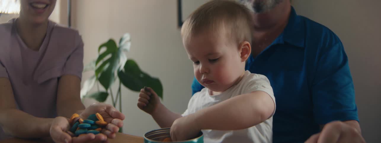 A clip of parents playing with their kid